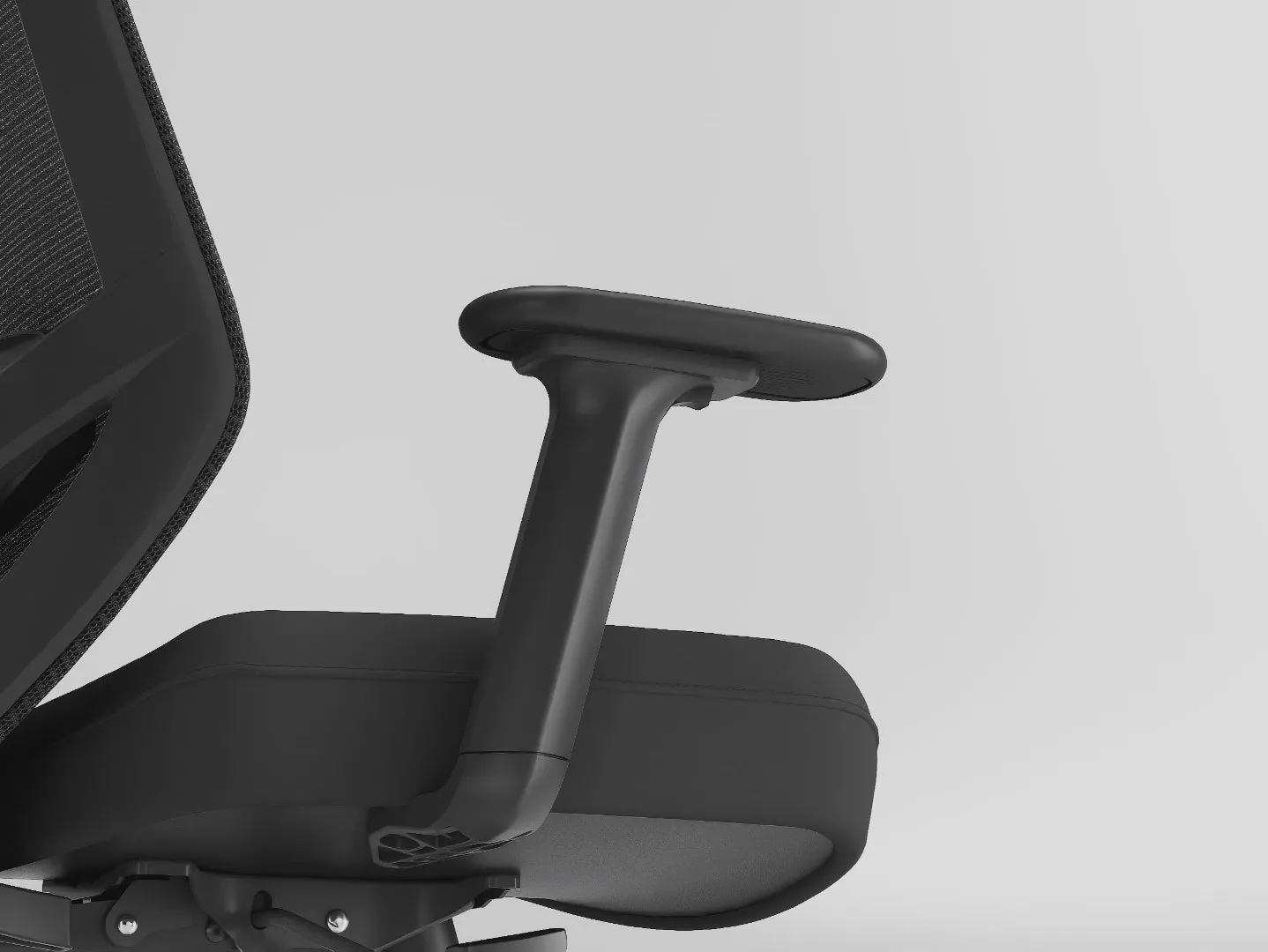 Holludle's close-up of the Ease Chair's adjustable armrest